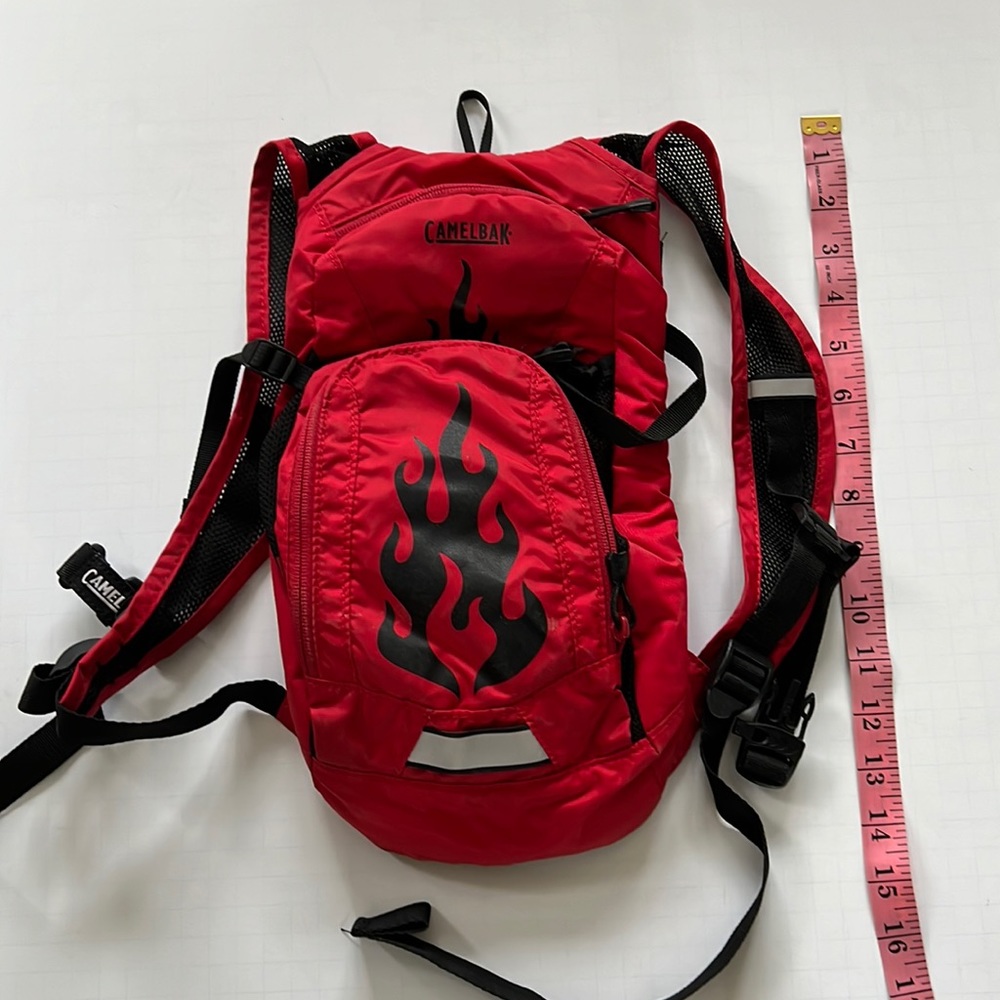 Small red camelbak hiking backpack. No bladder included